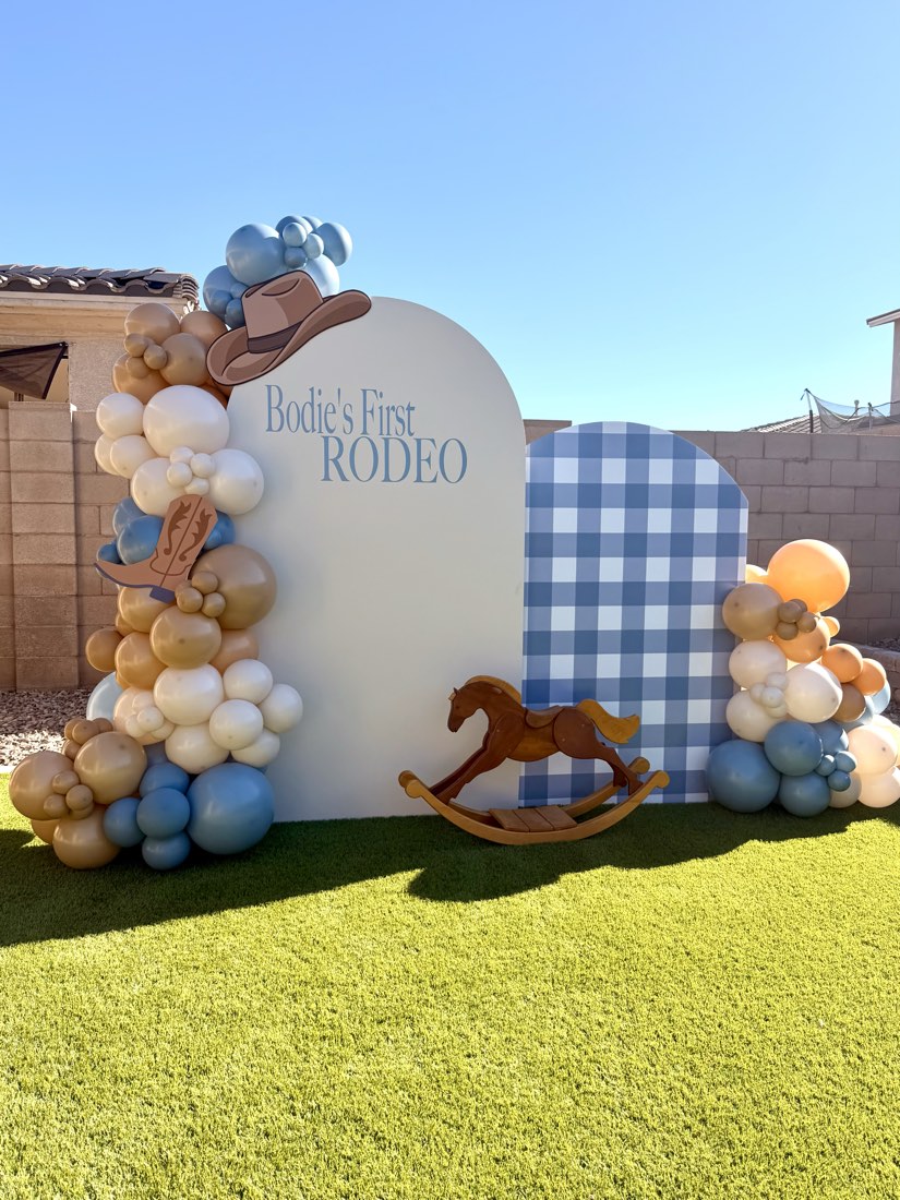 Bodie's First Rodeo western-themed first birthday balloon backdrop with cowboy hat and rocking horse by AZ Party Co.