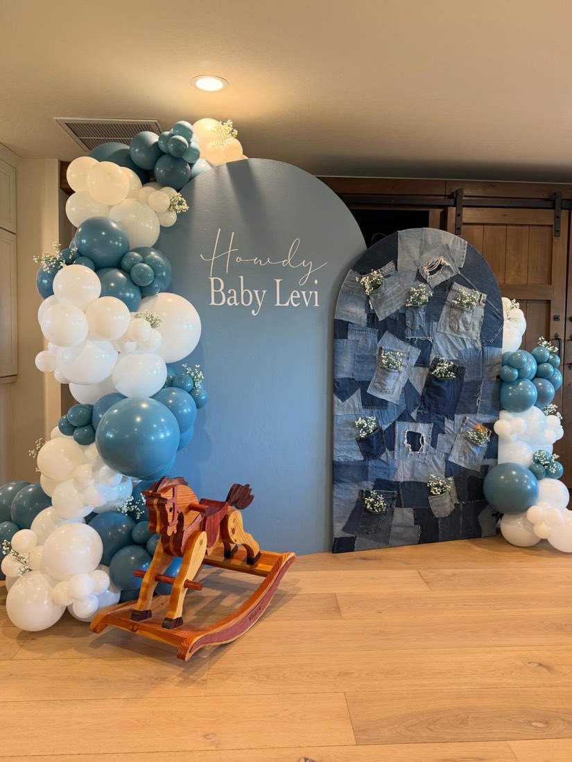Howdy Baby Levi denim-themed baby shower balloon backdrop with rocking horse by AZ Party Co.